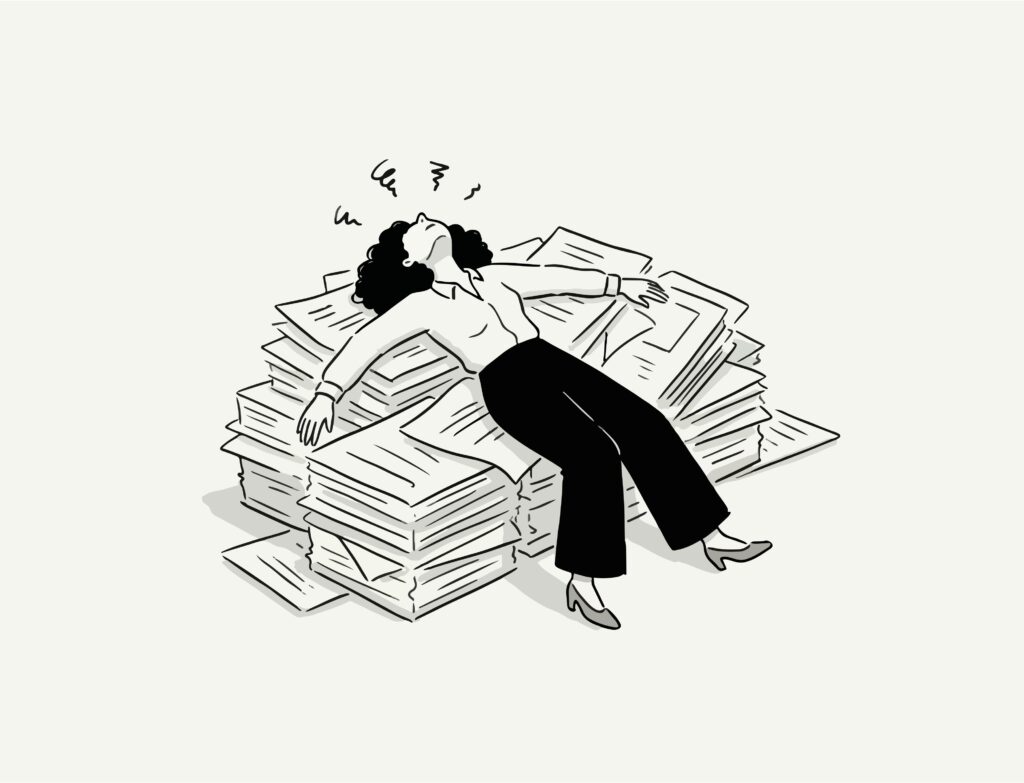 A woman on pile of papers showing frustration